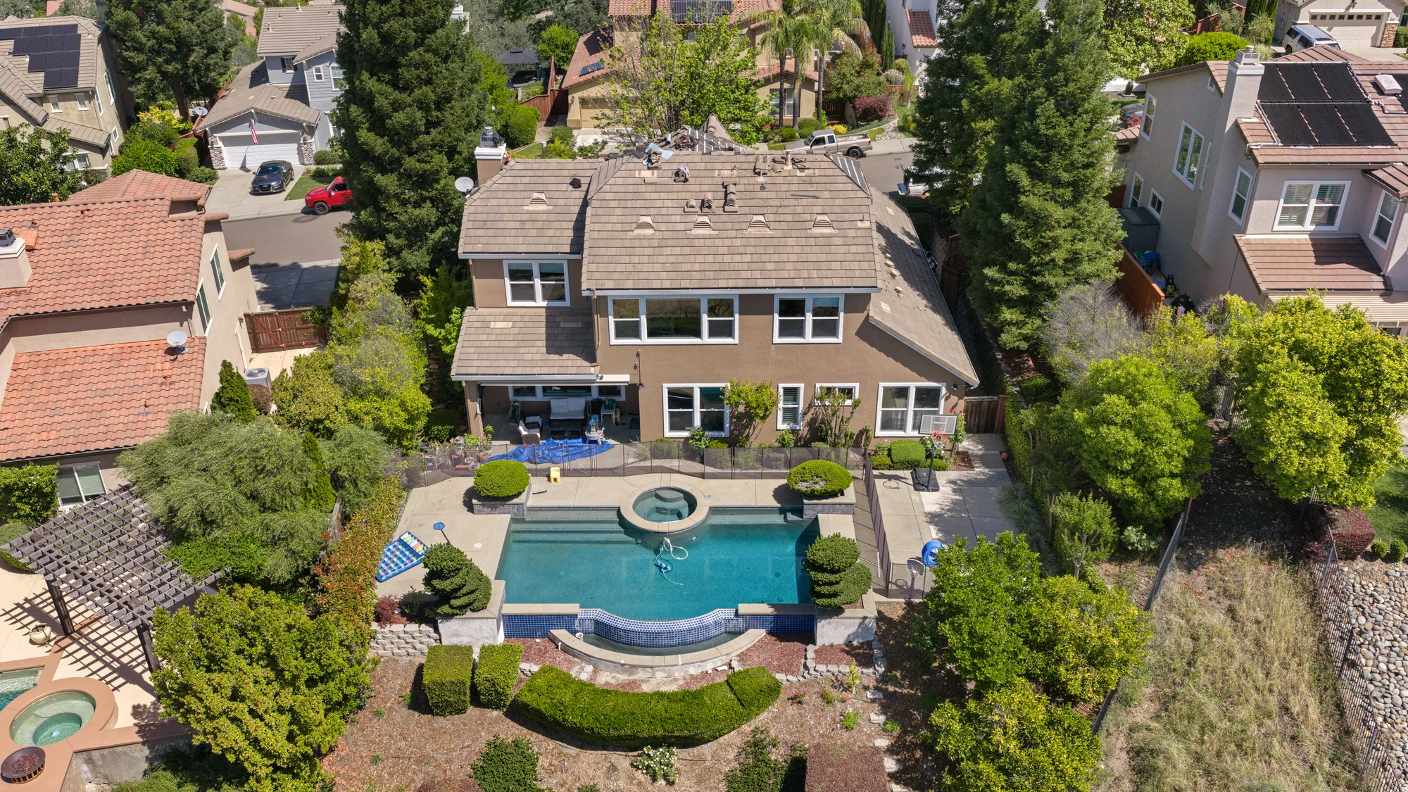 Aerial view of a premium roofing project and surrounding neighborhood